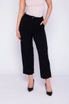 A pair of ankle-length black pants for women displayed on a white background, showcasing a slim-fit design suitable for modern fashion styles.