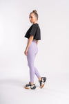 women in lavender pants and black crop top as active wear and gymwear