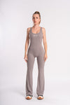 Full-body grey flared pants jumpsuit, backless and ideal for gym workouts and yoga practice.