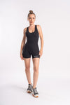 Fitted black romper with a scoop neckline and logo, worn by a woman