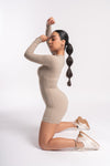 Women's beige long sleeve unitard with a zip-front design