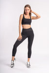 Women's athletic three-piece set - yoga pants, sports bra, and zip-up jacket