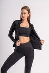 Stylish gym outfit - matching yoga pants, sports bra, and athletic jacket