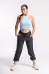 Woman black jogger-style track pants with elastic waistband.