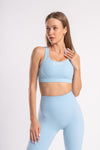 High-performance blue yoga pants and cross-back sports bra set - moisture-wicking activewear