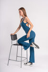 Women's yoga blue jumpsuit, backless and flared, for gym workouts and CrossFit training