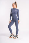 Women's gym jumpsuit with zipper front, body-hugging fit, and long sleeves