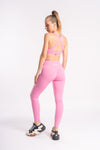 Pink yoga pants and sports bra with breathable fabric suitable for yoga sessions and gym days