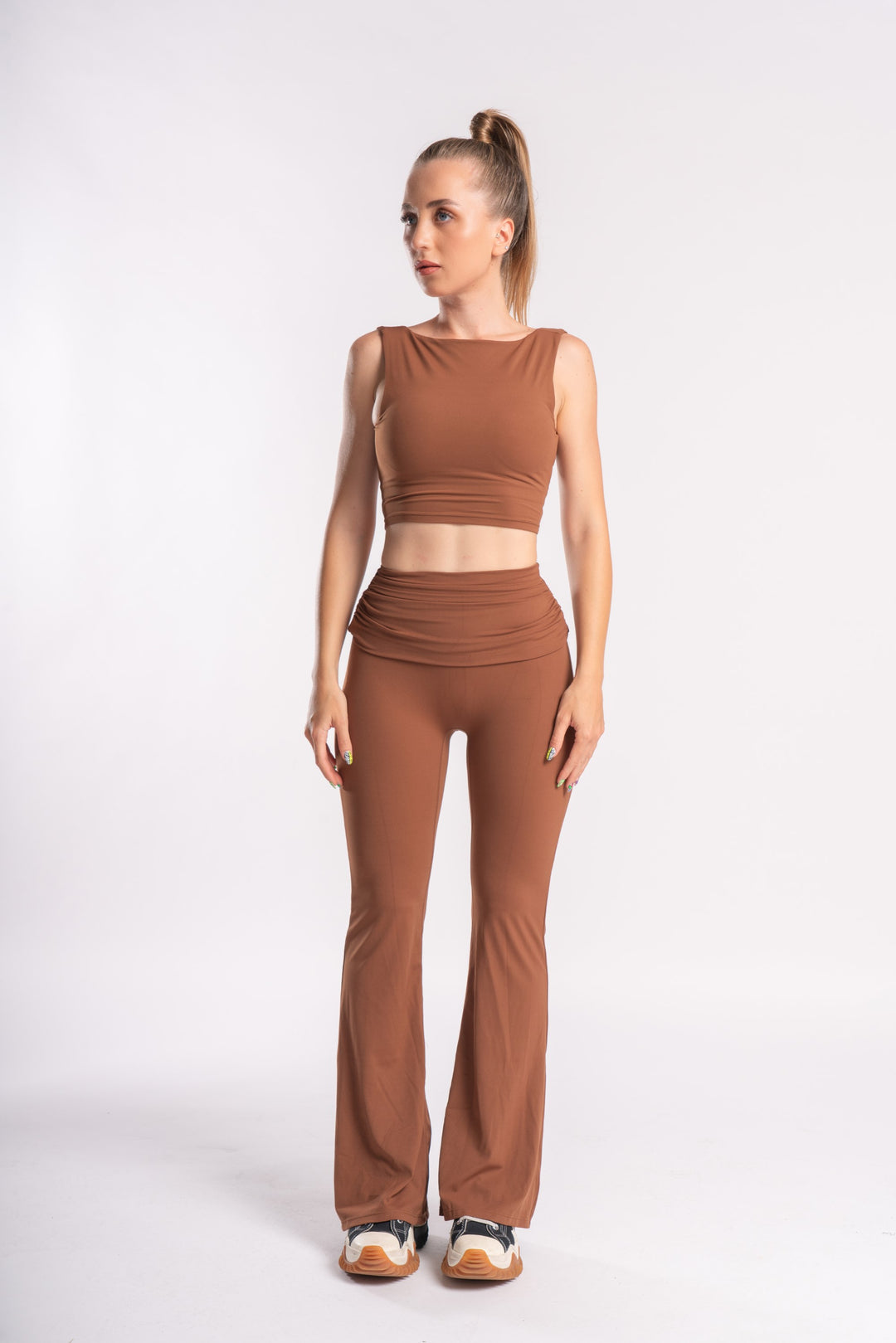 Fitted sleeveless crop top with backless design and high-waist flare pants