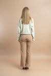 Women's cream wide-leg pants featuring a tailored waistband and wide, breezy legs