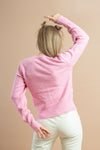 women's fashion baby pink pullover with barbie logo styled with white pants