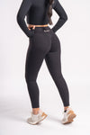 Seamless black high-rise leggings with long-sleeve cropped top, nylon spandex yoga set