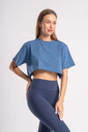 Blue oversized crop tshirt styled with dark blue pants suitable for active wear