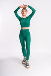 woman wearing green color set of crop top and yoga pants