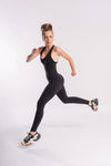 Backless black yoga jumpsuit for women, perfect for flexible movement