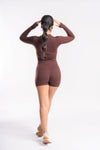 unitard with a short length, designed for a form-fitting, modern look.