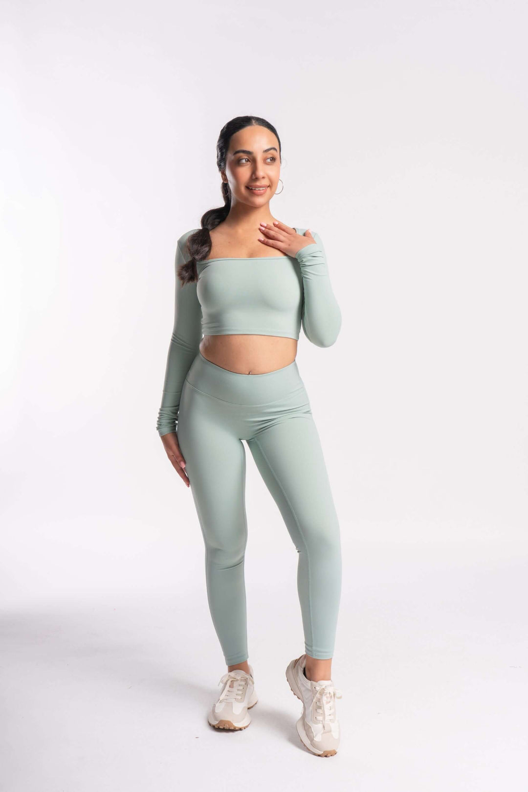 Full length sleeves cropped top paired with yoga pants for woman 