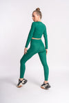 Green leggings crafted from a stretchy fabric, designed for comfort and flexibility