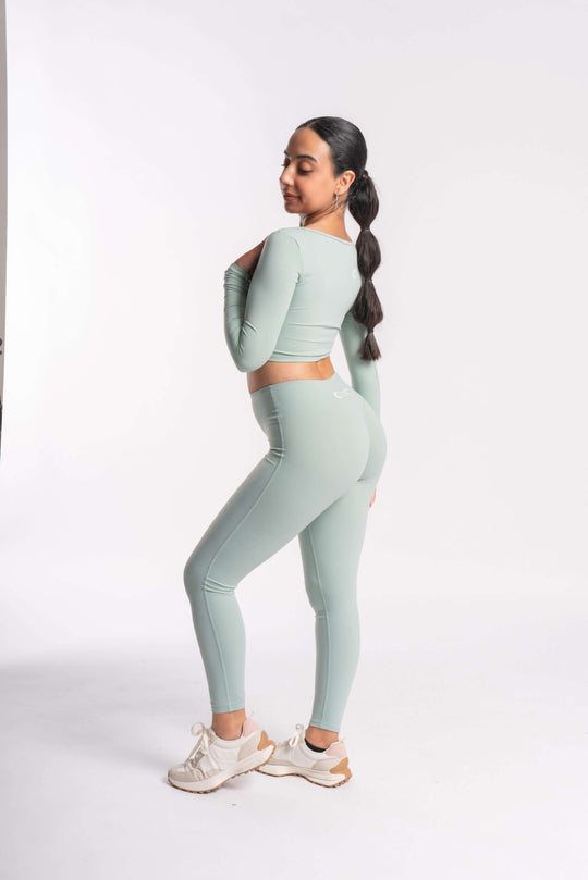 A set of stretchable cropped top and yoga pants with breathable fabric