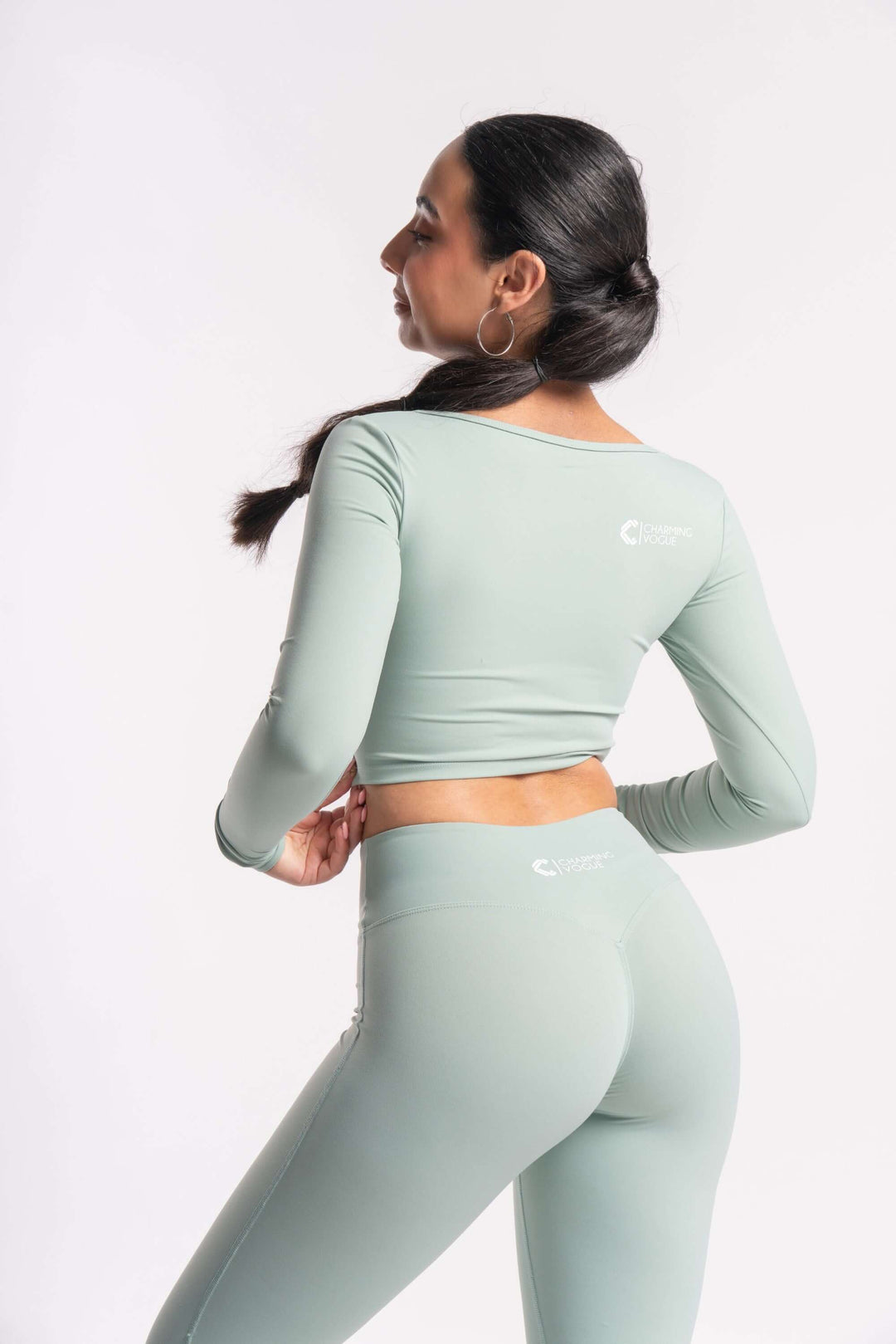 woman exercise clothing of grey mist color with top and bottom wear