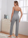 grey ribbed loungewear outfit, including a tank top, drawstring pants, and a cardigan, casually standing