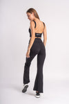 Elegant backless crop top and flare yoga pants perfect for yoga and leisure