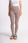 Women's taupe yoga pants, featuring a seamless design and stretch for comfort