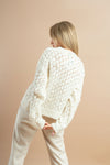 Elegant white knitted sweater with rhinestone details for women