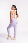 Women’s activewear set - high-waisted yoga pants and cross-back sports bra.