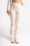 White seamless high-waist yoga leggings with matching long-sleeve crop top