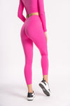 woman wearing high waist yoga pants with moisture wicking top for woman