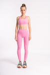 Pink performance gear set of yoga pants and cross back sports bra