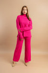 Women's pink turtle neck knitted two-piece set with full sleeves and wide-leg pants