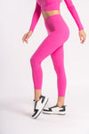 set of pink color compression high waist leggings for woman paired with cropped top