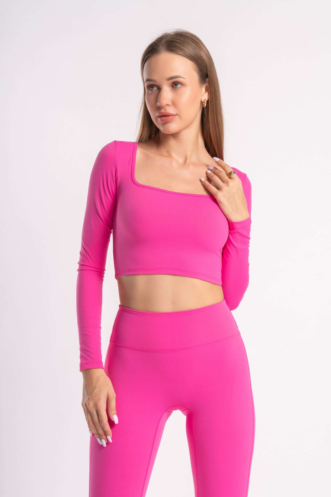 set of pink seamless yoga pants along with sports bra for woman