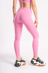 lady wearing pink color crossfit apparel paired with sports shoes giving comfortable and casual look