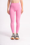 pink color yoga pants for workout and gym paired with sports bra and sports shoes