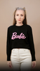 Barbie Logo Cotton Black Sweatshirt styled in a casual video against a beige background