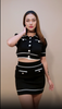 woman wearing black color knitted wool co-ord set of crop shirt and skirt