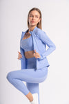 Stylish yoga outfit - three-piece set with yoga pants, sports bra, and jacket