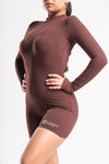 short unitard for women with long sleeves and a zip front, perfect for workouts 