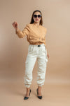 Women's beige short winter jacket with long sleeves and a cropped fit