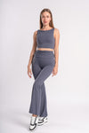 Minimalist sleeveless crop top and flared yoga pants set, backless design