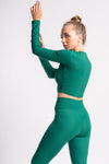 Green gym set featuring a stretchy fabric, providing ease of movement