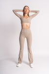 Stylish workout set: long-sleeve crop top and high-waist yoga pants beige