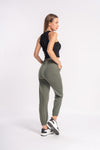 green woman's jogger track pants with tapered legs for active wear