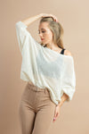 Fashionable white batwing sleeve sweater, great for casual and winter outfits.