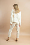 White rhinestone-decorated knit sweater for women’s casual wear.