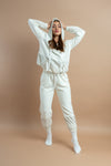 Stylish white crop tracksuit with a hood, ideal for women’s casual and activewear