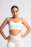 Women’s white sportswear set with high-waisted shorts and bra for training